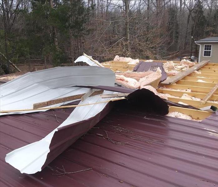 Damage to roof due to tornado.
